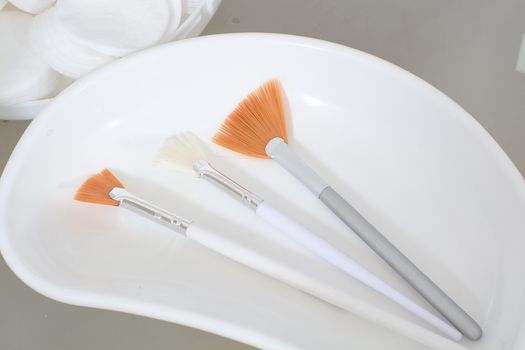 Close-up view of the cosmetic brushes for peeling and facial cleansing. Medical and beauty equipment healthcare. Modern medical and beauty technology concept. 
