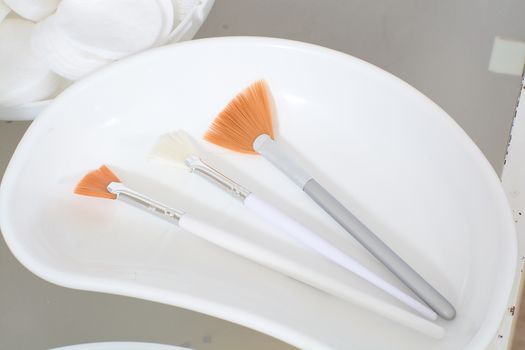 Close-up view of the cosmetic brushes for peeling and facial cleansing. Medical and beauty equipment healthcare. Modern medical and beauty technology concept. 