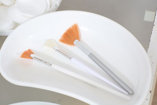 Close-up view of the cosmetic brushes for peeling and facial cleansing. Medical and beauty equipment healthcare. Modern medical and beauty technology concept. 