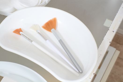 Close-up view of the cosmetic brushes for peeling and facial cleansing. Medical and beauty equipment healthcare. Modern medical and beauty technology concept. 