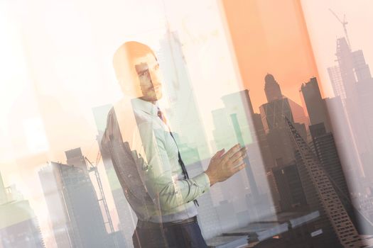 Business man making presentation in corporate office. Business executive delivering a presentation during business meeting against new york city manhattan buildings and skyscrapers window reflection.