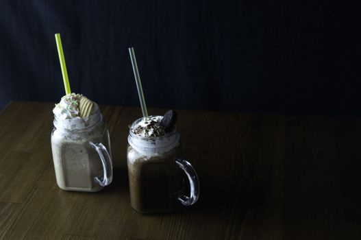 the service desk with a glass of iced tea and placed a glass of cold chocolate