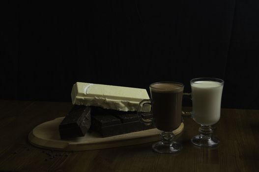 molded chocolates with exotic drinks with milk and chocolate