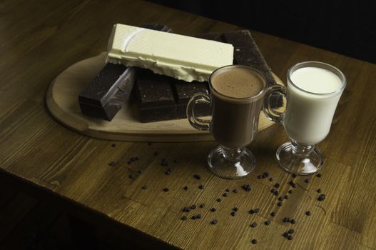 molded chocolates with exotic drinks with milk and chocolate