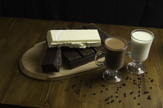 molded chocolates with exotic drinks with milk and chocolate