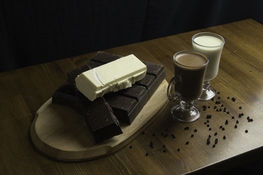 molded chocolates with exotic drinks with milk and chocolate