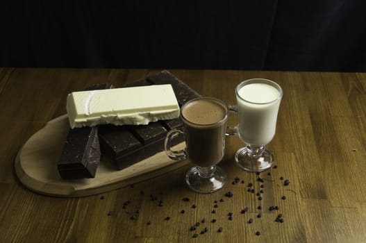 molded chocolates with exotic drinks with milk and chocolate