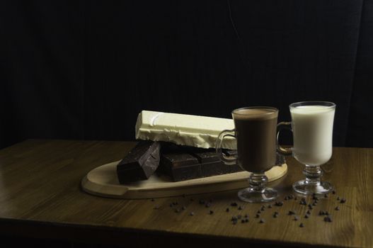 molded chocolates with exotic drinks with milk and chocolate