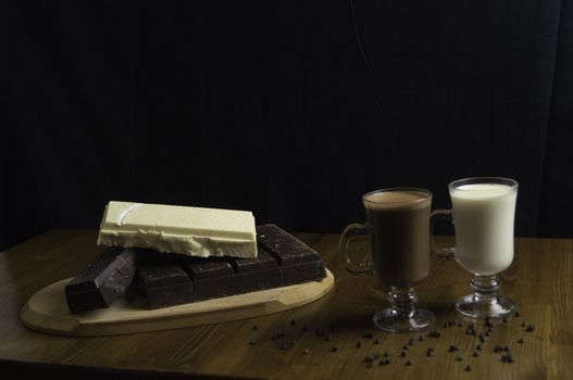 molded chocolates with exotic drinks with milk and chocolate