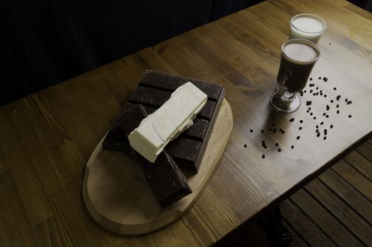 molded chocolates with exotic drinks with milk and chocolate