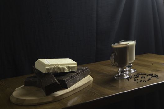 molded chocolates with exotic drinks with milk and chocolate