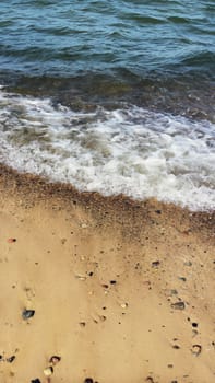 Sand and wave closeup.  Summer time background.