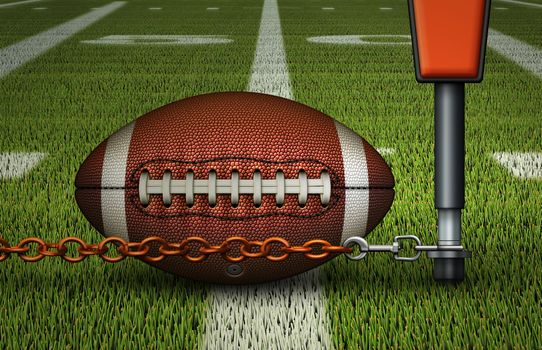 Closeup of an american football on the fifty yard line,  just inches away from the first down marker & chain. 3D Illustration