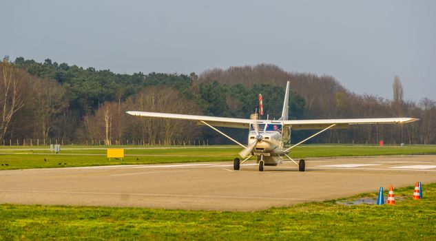 white airplane landing on the air strip, recreational sport and hobby, air transportation