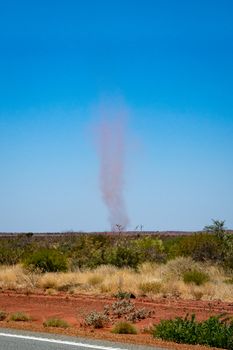 Big landspout whirlwind sand tornado dust devil in Australian dessert