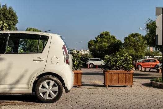 a city shoot from a parking area with cars and trees. photo has taken from izmir/turkey.