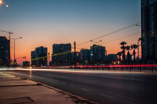 a long exposure cityscape shoot at sunset - orange color is dominant. photo has taken at izmir/turkey.