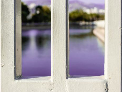 an artistic landscape shoot from a canal with purple colors - used metal as a frame. photo has taken from izmir/turkey.