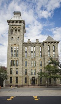 Old historical building in downtown Rochester, New York, with blue cloudy sky