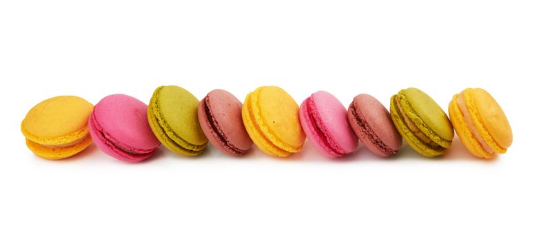 french colorful macarons isolated on white background