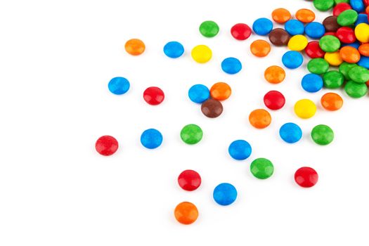 colorful chocolate buttons on a white background