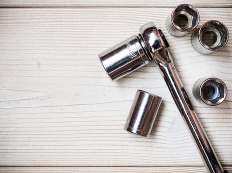 Several spanners on wooden board. Construction concept