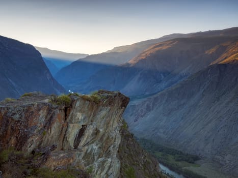 A view of the mountains in the light of the setting sun