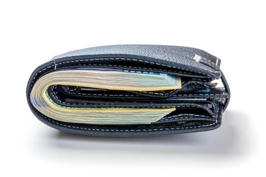 Tight-packed wallet with 100 dollar bills on a white background