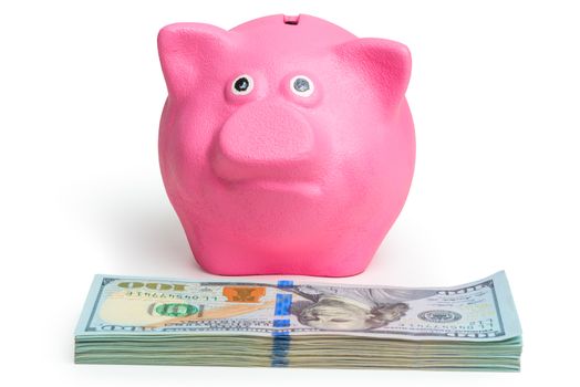 pink piggy bank and pile of american dollars on white background isolated