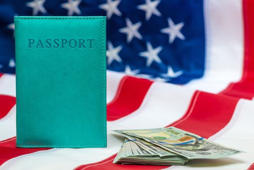 Finance concept passport, money on the national flag of the United States close-up objects