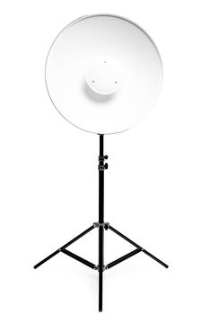 Round metal photo flash on a rack in a photo studio on a white background close-up