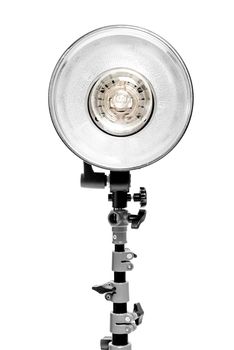 powerful photo flash lamp on rack on white background in studio close up