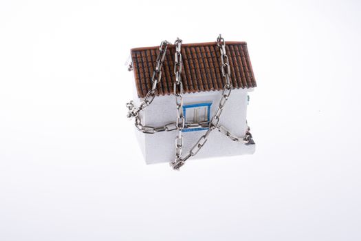 house in chains on a white background