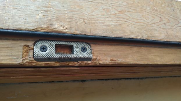 Metal bracket for the lock in the door frame.
