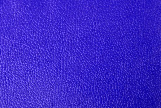 Bright blue leather background, part of an old binder folder