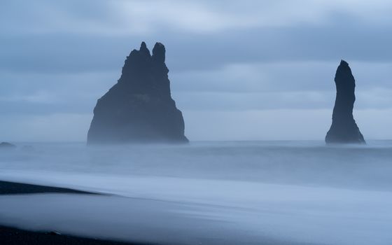 Rock spire of Reynisdrangur, coast of Reynisfjara close to Vik, Iceland, Europe
