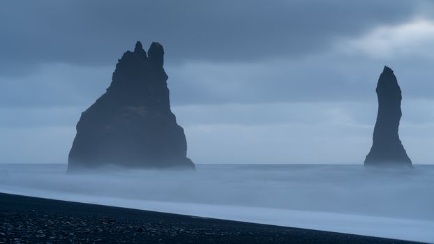 Rock spire of Reynisdrangur, coast of Reynisfjara close to Vik, Iceland, Europe
