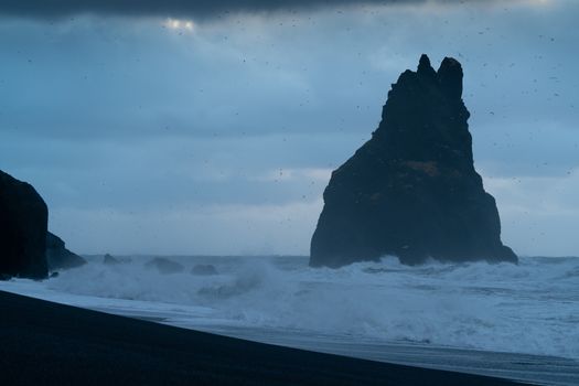 Rock spire of Reynisdrangur, coast of Reynisfjara close to Vik, Iceland, Europe