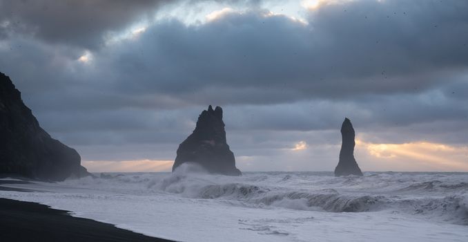 Rock spire of Reynisdrangur, coast of Reynisfjara close to Vik, Iceland, Europe