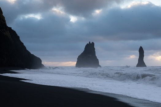 Rock spire of Reynisdrangur, coast of Reynisfjara close to Vik, Iceland, Europe