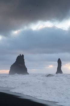 Rock spire of Reynisdrangur, coast of Reynisfjara close to Vik, Iceland, Europe