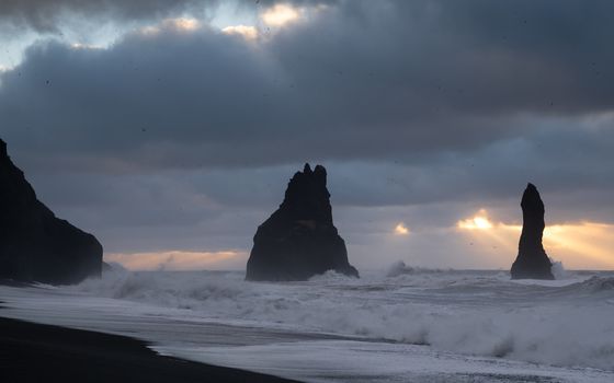Rock spire of Reynisdrangur, coast of Reynisfjara close to Vik, Iceland, Europe