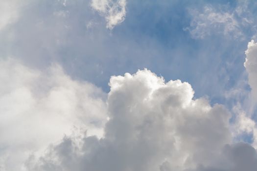 Beautiful white clouds in the blue sky, background.