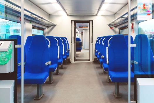 Interior of an empty passenger car commuter train.