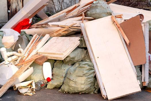 A pile of trash, garbage and old furniture submitted for disposal in the trash.