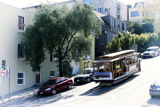 San Francisco, California, USA - October 9, 2013: Historic San Francisco Cable Car on famous California Street at morning, California, USA