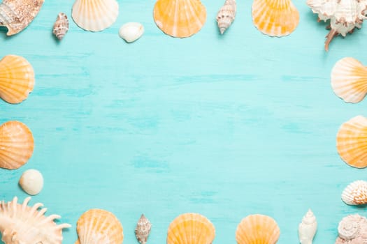Blue sea background with copy space and seashell border, summer holiday and vacation concept.