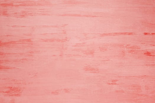 Old wooden board painted with coral paint, background, texture.