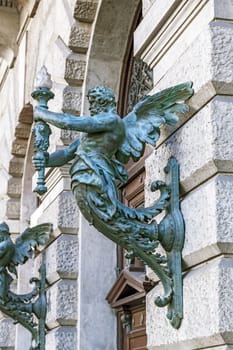 Wall lantern in the shape of a man, Budapest, Hungary