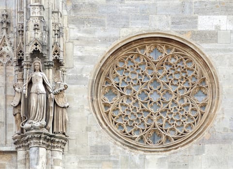 Round gothic window on the facade of the St. Stephen's cathedral, Vienna, Austria